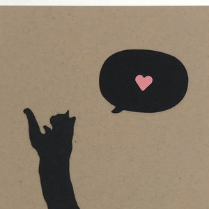 Cat Climbing with Heart
