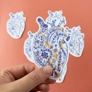 Kintsugi broken heart vinyl sticker - delft blue floral anatomical sticker