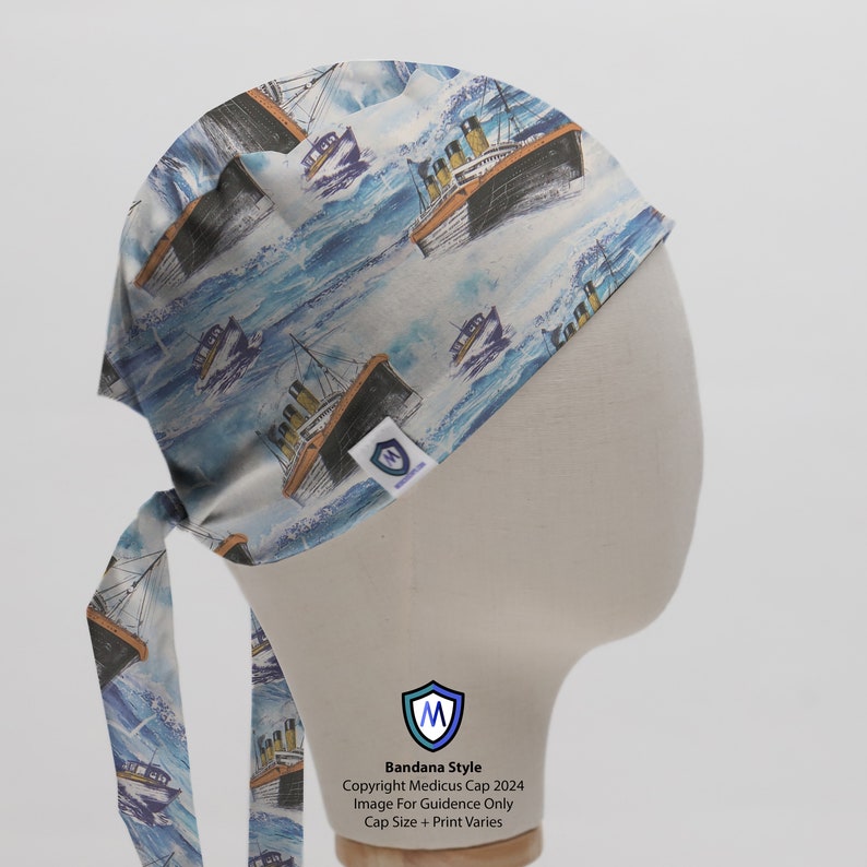 May include: A white bandana with a blue and white pattern of ships on a wavy sea. The bandana is tied in a knot at the back of the head. The text "Bandana Style" is printed on the bandana, along with the copyright information "Copyright Medicus Cap 2024". The text "Image For Guidance Only" and "Cap Size + Print Varies" is also printed on the bandana.