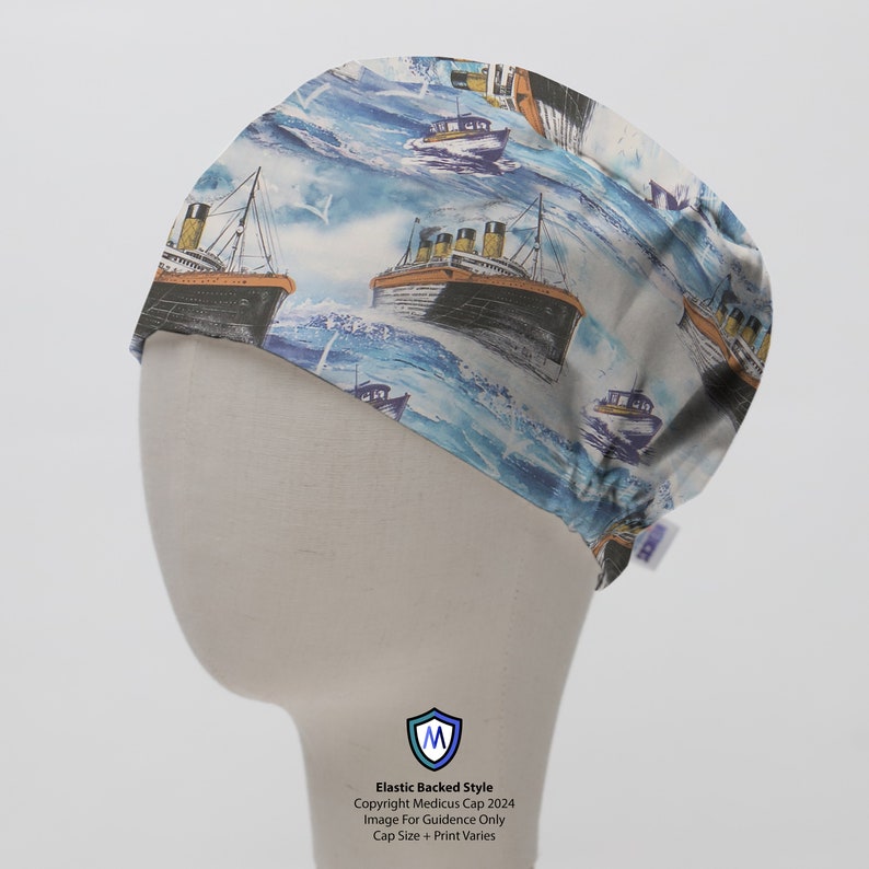 May include: A blue and white patterned surgical cap with an elastic back. The pattern features a repeating image of a large ocean liner sailing on the water. The cap has the text "Copyright Medicus Cap 2024" and "Image For Guidance Only" printed on the bottom.
