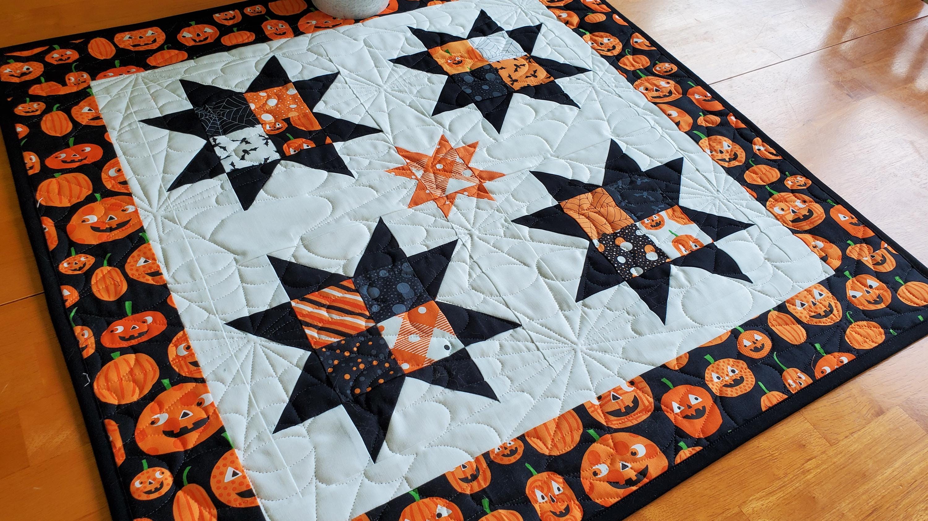 Yuletide Glow Quilted Table Topper NCU0NNT1640