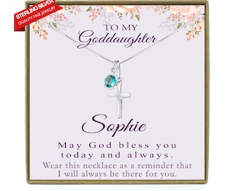 May include: A silver necklace with a cross charm and a teal blue gemstone. The necklace comes in a box with a message that reads "To my Goddaughter Sophie May God bless you today and always. Wear this necklace as a reminder that I will always be there for you."