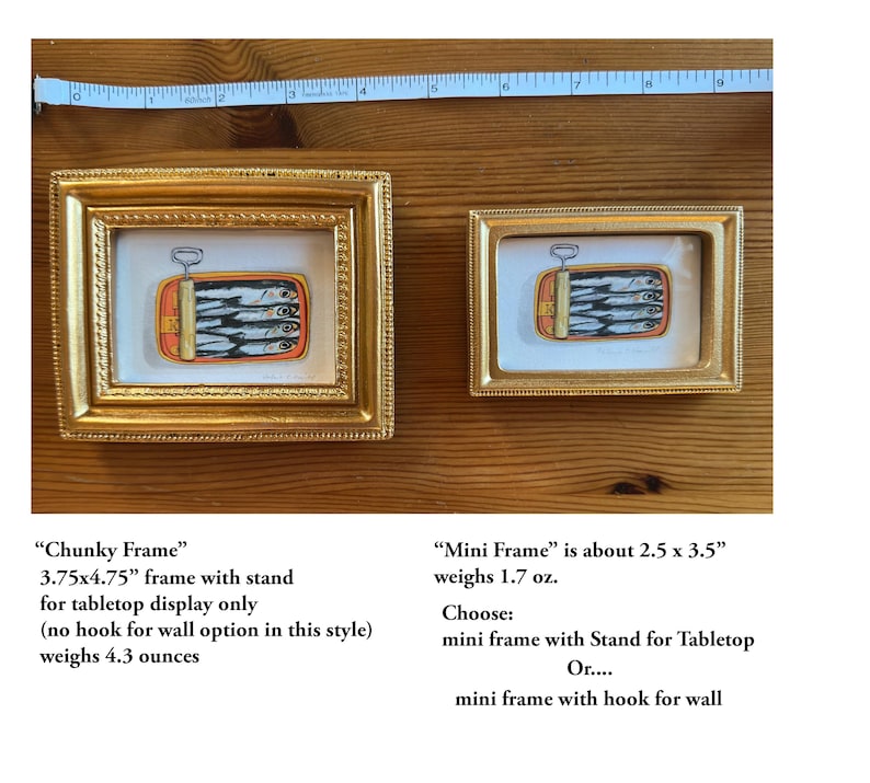 May include: Two gold-framed art pieces featuring a sardine can illustration. The larger frame is 3.75x4.75 inches, and the smaller is about 2.5 x 3.5 inches. The text on the image says "Chunky Frame" and "Mini Frame".