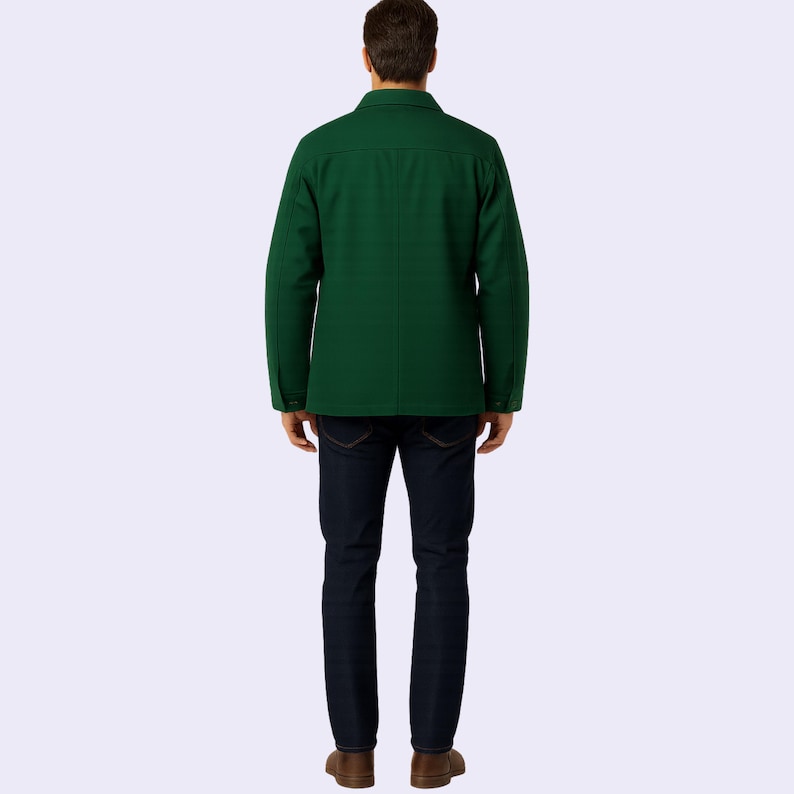 May include: A dark green jacket with a button-down front and long sleeves. The jacket is paired with dark blue jeans and brown shoes. The person is viewed from the back, showcasing the jacket's design and fit.