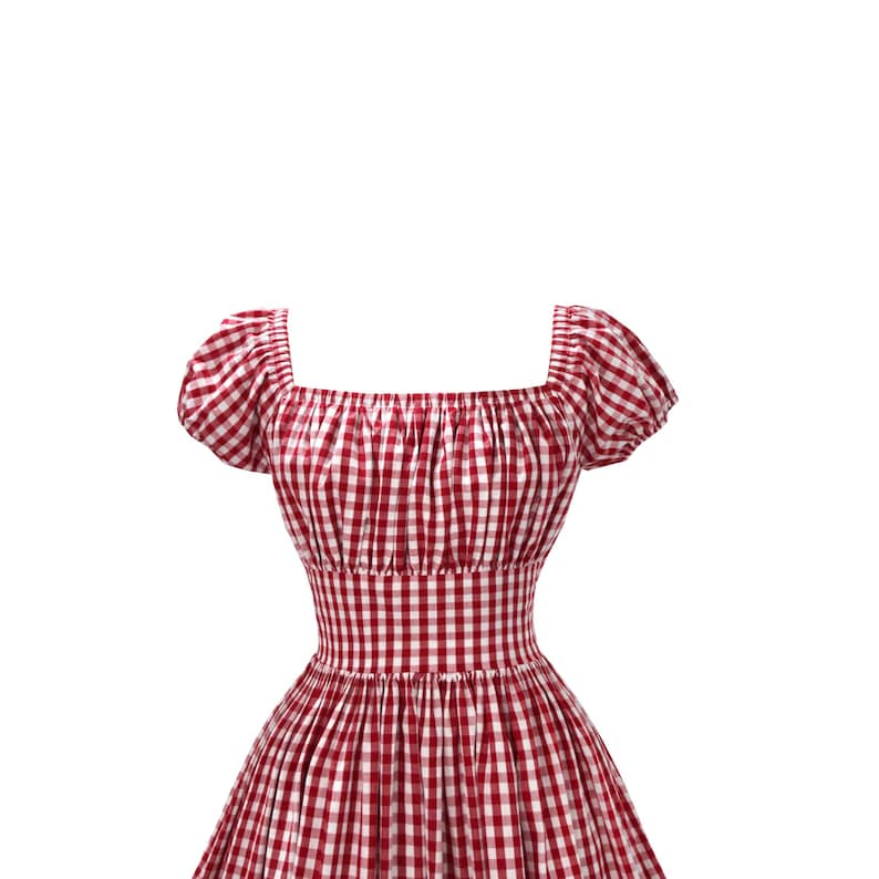 May include: A red and white gingham dress with a square neckline and short, puffed sleeves. The dress features a fitted bodice and a flared skirt, creating a classic, feminine silhouette. The fabric has a checkered pattern.