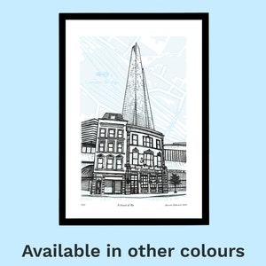 May include: Black framed art print featuring a detailed pen and ink illustration of a London cityscape, including The Shard and other buildings. The background has a light blue map design. The text "A shard of Ale" is visible. The words "Available in other colours" are at the bottom.