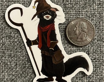 May include: A black and white ferret wearing a brown wizard hat with a gold star, a red scarf, and brown leather armor. The ferret is holding a white staff with a curved top. The ferret is standing on a white background.