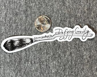 Defying Gravity - glossy vinyl sticker