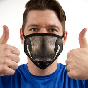 May include: A black face mask with a printed image of a brown and black pig snout with large white tusks.