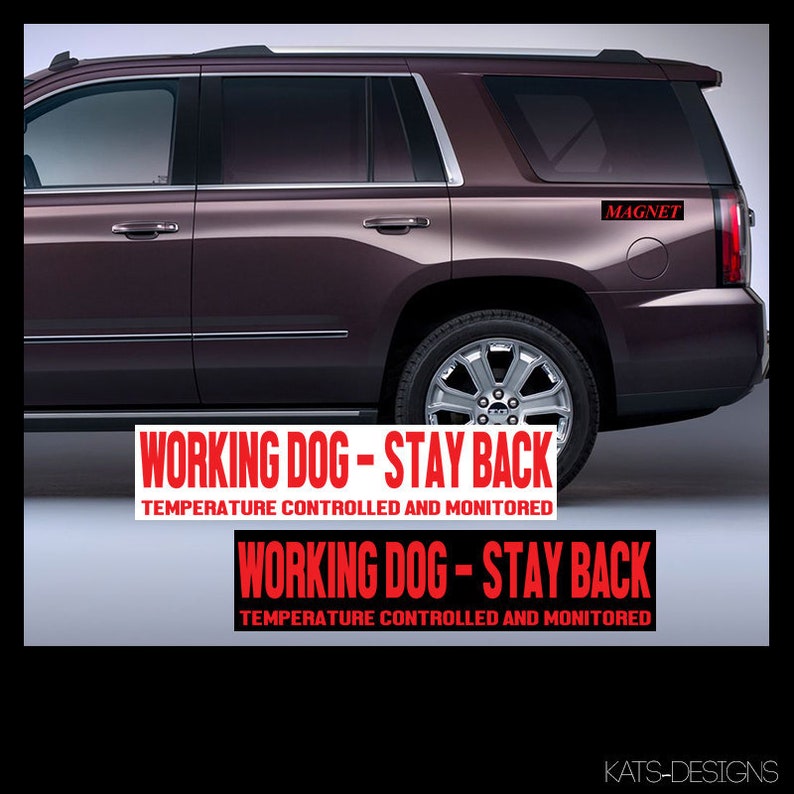 May include: Two red and white magnetic signs that read 'Working Dog - Stay Back' and 'Temperature Controlled and Monitored.' The signs are attached to the back of a dark brown SUV.