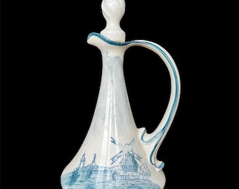 Jarra francesa vintage con tapa de corcho: Jarra de loza decorada con motivos turquesa.