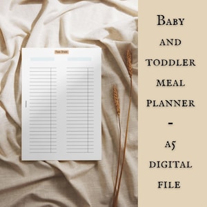 May include: A white A5 digital meal planner for babies and toddlers, with lined sections for meal planning. The words "Baby and Toddler Meal Planner - A5 Digital File" are printed on a beige background. The planner is on a beige fabric.