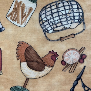 May include: A brown and white chicken figurine with a green base, a jar filled with brown sticks, a wire egg basket with white eggs, a slice of orange, cinnamon sticks, and red berries on a tan background.