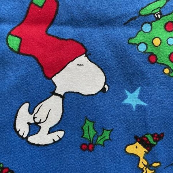 Snoopy w/stocking hat on blue w/Woodstock, Concord Fabrics – sold by the half yard