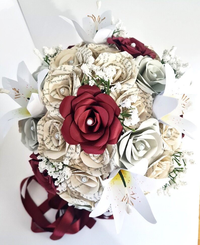 Teardrop book bridal bouquet with paper lilies, artificial gypsophila and trailing ribbons // The Courtney image 2