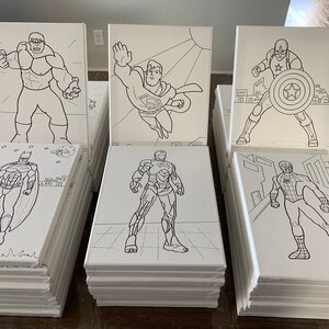 May include: A set of 6 blank canvas paintings featuring black and white line drawings of popular superheroes. The superheroes include Hulk, Superman, Captain America, Batman, Iron Man, and Spiderman.