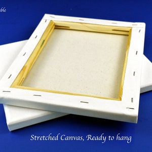 May include: Two white stretched canvases with wooden frames, ready to hang. The canvases are stacked on top of each other. The text "Sizes available" is written above the canvases, followed by three sizes: 8"x10", 9"x12", and 11"x14". The text "Stretched Canvas, Ready to hang" is written below the canvases.