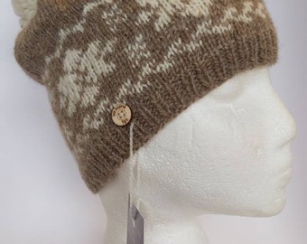 Keep out the cold this winter with a hand knitted Isle Inspired woolly hat. Made from undyed handspun Shetland yarn. Small adult size.