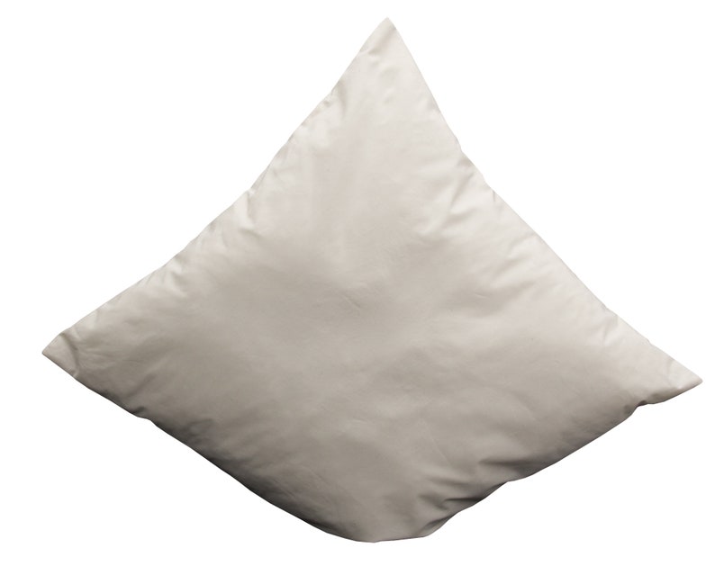 May include: A plain white pillow with a diamond shape.