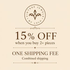 May include: A cream-colored graphic featuring a circular logo at the top with the text VINTAGE JEWELS BY LULU. Below, the text reads 15% OFF when you buy 2+ pieces, followed by ONE SHIPPING FEE and Combined shipping, all in dark brown lettering.