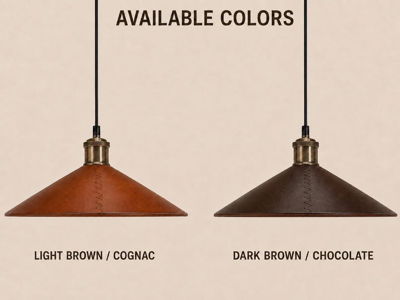 May include: Two cone-shaped pendant lights with black cords and brass-toned hardware. The left shade is light brown cognac leather, and the right shade is dark brown chocolate leather. Text reads AVAILABLE COLORS, LIGHT BROWN / COGNAC, DARK BROWN / CHOCOLATE.