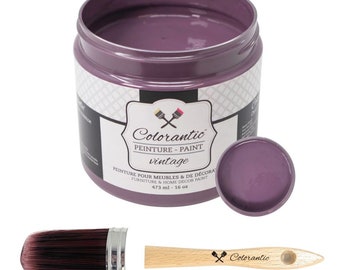 May include: A jar of vintage-style Colorantic paint in a muted purple hue, with a matching lid and a paintbrush. The jar contains 16 oz of paint. A small wooden paint scraper with the Colorantic logo is also included.