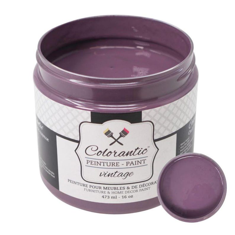 May include: A 473 ml jar of Colorantic vintage paint in a purple shade. The jar has a white label with the brand name and product details. The label reads "Colorantic, Peinture - Paint, vintage, Peinture pour meubles & de decorat, Furniture & Home Decor Paint, 473 ml - 16 oz."