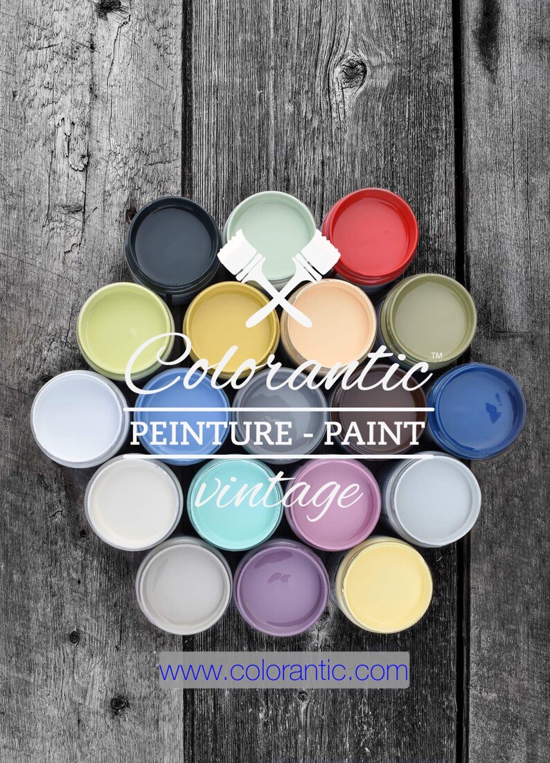 May include: A collection of 14 paint jars in various colors, including green, blue, yellow, red, and white. The jars are arranged in a circle on a wooden surface. The text "Colorantic&trade; PEINTURE - PAINT vintage www.colorantic.com" is visible in the center of the image.