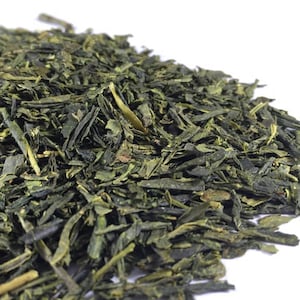 May include: Loose green tea leaves, a popular choice for brewing a refreshing beverage.