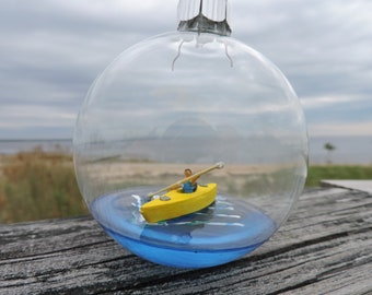 Kayak in a bottle, Glass holiday ornament, paddling on blue water