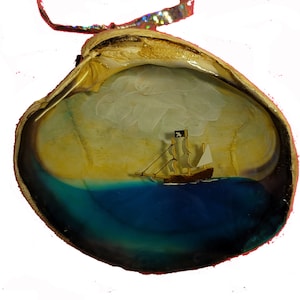 Pirate Ship Sailing in a Shell Ornament