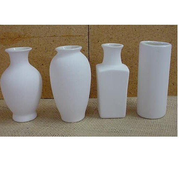 Vases - four small vases in bisque approx 3 3/4" tall