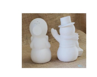 Salt & Pepper shakers in forms of the old fashioned snowman and snow lady