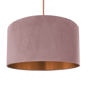 May include: A dusty rose velvet lampshade with a copper-colored inner lining.