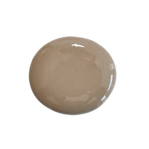 May include: A light brown ceramic dish with a smooth, glossy finish. The dish is round and slightly irregular in shape.