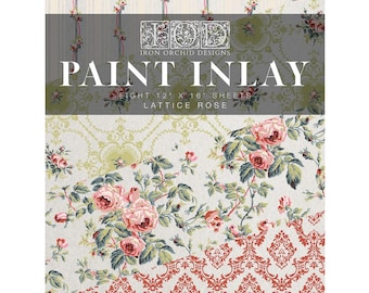 May include: A decorative sheet with floral and damask patterns. The top section features vertical stripes with small flowers. The middle section has the text "PAINT INLAY" and "LATTICE ROSE". The bottom section displays a large floral design with pink roses.