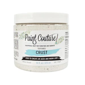 May include: A white jar of "Paint Couture" furniture paint with the texture "Crust." The label indicates it is water-based and used to create an aged look. The jar contains 16 fl. oz. / 473 ml of paint.