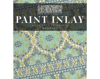 May include: A sheet of paint inlay paper with a repeating pattern in teal, gold, and navy blue. The design features floral and geometric shapes. Text on the paper reads "PAINT INLAY" and "MOROCCO". The paper measures 12 x 16 inches.