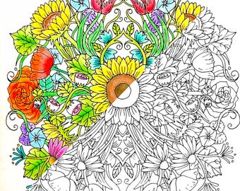May include: A symmetrical coloring page design featuring a large sunflower in the center surrounded by various flowers and leaves. The left side of the design is colored in with vibrant colors, while the right side is left blank for coloring.