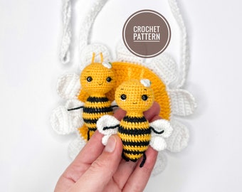 May include: Two crocheted bumblebees with black and yellow stripes, holding onto a white crocheted daisy with a yellow center. The daisy is attached to a white crocheted strap. The text "CROCHET PATTERN" is on a brown circle.