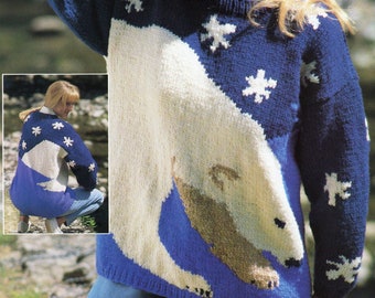 May include: A blue and white knit sweater with a polar bear design and snowflakes. The sweater has a crew neck and long sleeves. The text "PDF Pattern" is printed at the bottom of the image.