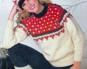 May include: A PDF knitting pattern for a white and red Fair Isle sweater with a matching hat. The sweater has a black and white trim and the hat has a white pom pom.