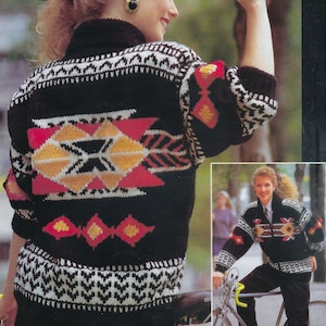 May include: A black knitted sweater with a geometric pattern in red, yellow, and white. The sweater has a high neck and a zip fastening.