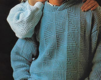 May include: Two light blue knitted sweaters with a geometric square pattern. One sweater has a hood, and the other has a crew neck. The sweaters are made of a soft, textured yarn.