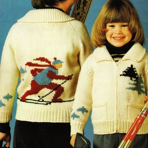 May include: A knitting pattern for two children's sweaters. The sweaters are cream colored with a skier design on one and a pine tree design on the other. The pattern is titled "PDF Pattern".