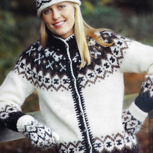 May include: A white, brown, and black knitted sweater, hat, and mittens set. The sweater has a button-up front and a geometric pattern across the chest and sleeves. The hat and mittens match the sweater's design. The outfit is perfect for cold weather.
