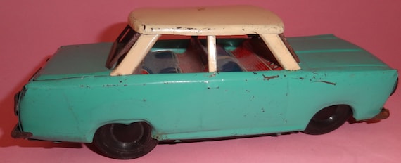Vtg GREEK NIKOLAIDIS Tin Windup Toy Car W/ Tin Lithographed Seats