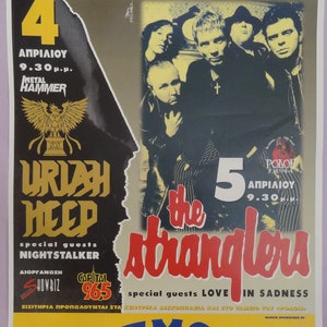 May include: A concert poster advertising two music events. The top event features Uriah Heep with special guests Nightstalker. The bottom event features The Stranglers with special guests Love in Sadness. Both events are sponsored by Camel Music and will take place at Rodon in Athens, Greece.