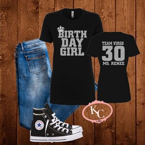May include: Black t-shirt with silver glitter text that reads "BIRTHDAY GIRL" with a crown above the word "BIRTHDAY". A second black t-shirt with silver glitter text that reads "TEAM VIRGO 30 MS. RENEE". A pair of blue jeans and black high-top sneakers.