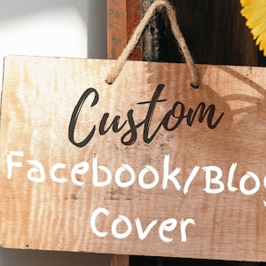 May include: A wooden sign with the text "Custom Facebook/Blog Cover" written in white paint. The sign is hanging from a string and has a rustic, natural look.